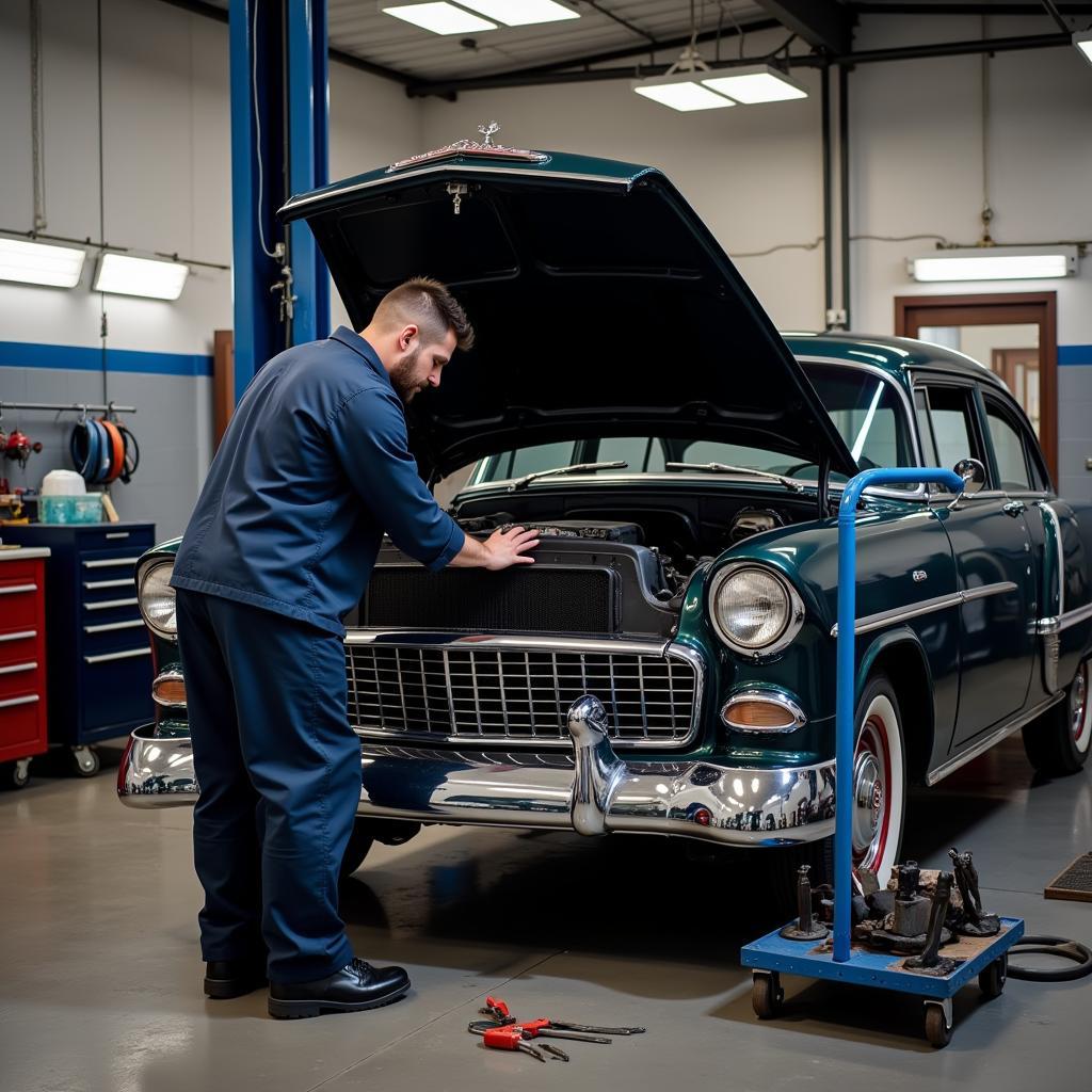 Mechanic working on the engine of an American car in a professional lift