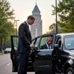 Professional chauffeur assisting a passenger