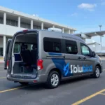 Modern and spacious Bluebird airport shuttle van