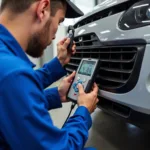 Mechanic checking car air conditioning system