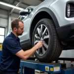 Car undergoing wheel alignment service