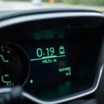 Car dashboard with mileage and service reminder