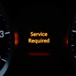 Car dashboard displaying "Service Required" light