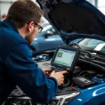 Mechanic using diagnostic equipment on a car engine