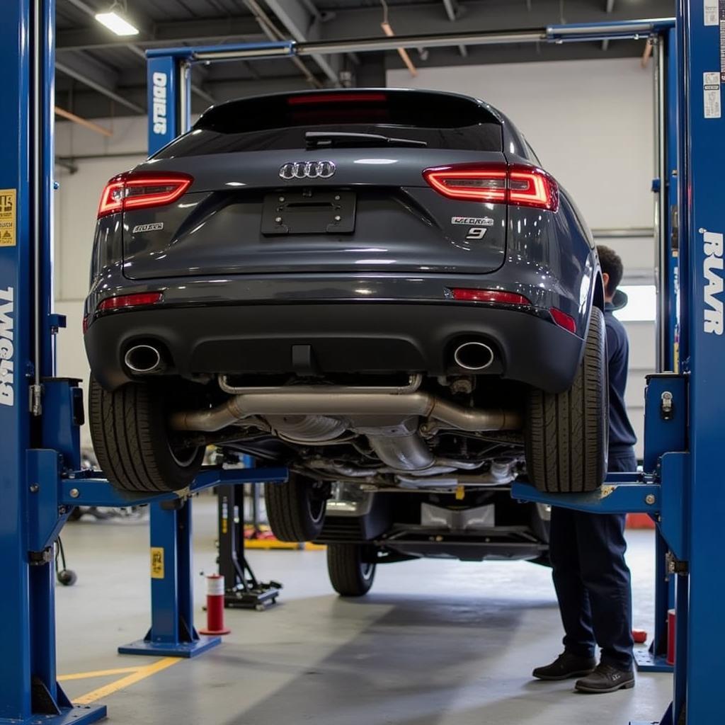 Car on a lift in a service bay