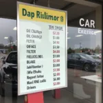 A price list for common car service items displayed at a Bournemouth garage