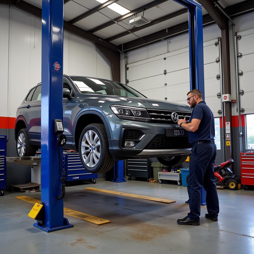 Vehicle on a hydraulic lift during MOT test