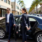 Chauffeur helping a passenger into a car in Beverly Hills