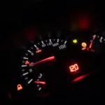 Car dashboard illuminated with warning lights