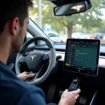 Technician Updating Electric Car Software