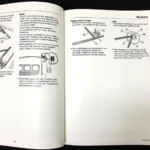 Open GM car owner manual with wiper service position instructions highlighted.