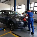 Car undergoing routine maintenance in a Goregaon West service center