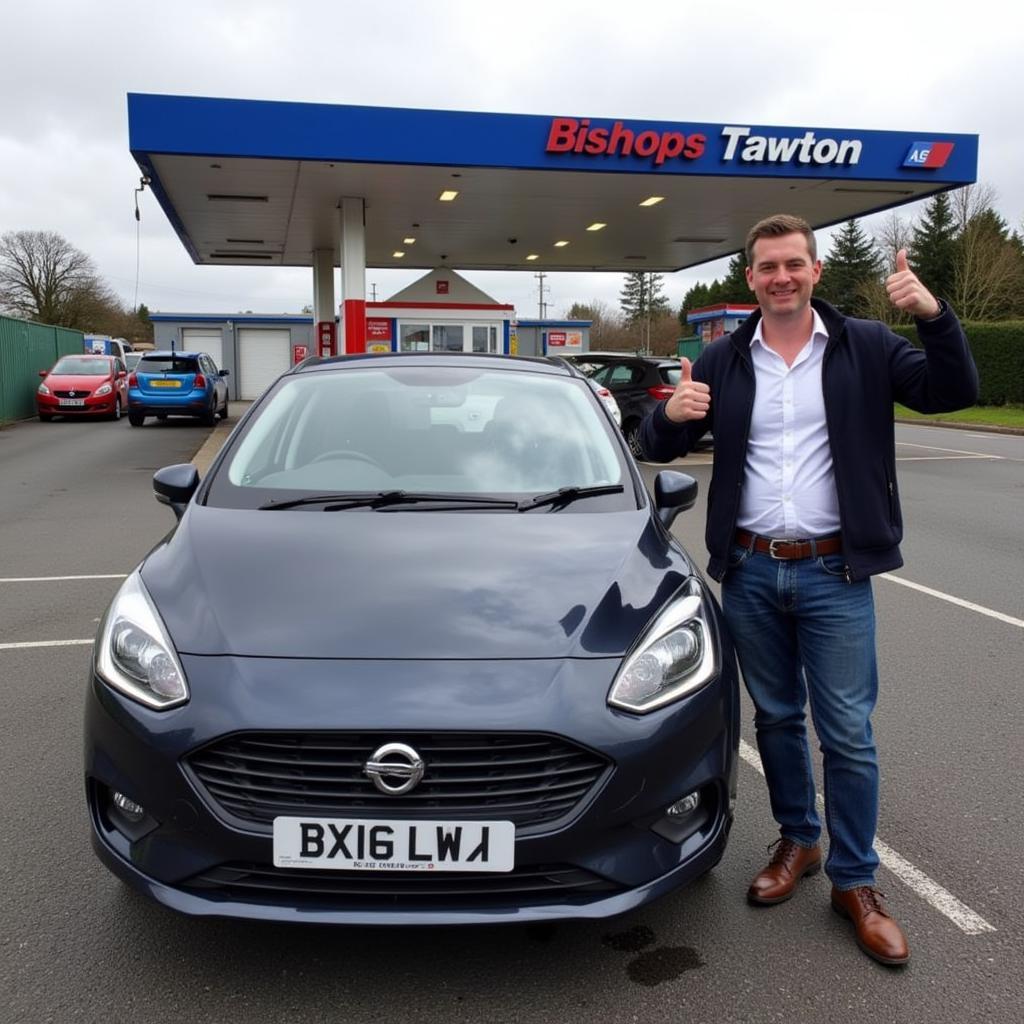 New car owner celebrates at Bishops Tawton service station