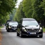 Hearse and service car in a funeral procession