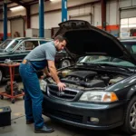 Mechanic working on a car in an independent garage