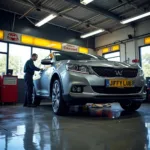 Car being serviced in a Jiffy Lube service bay