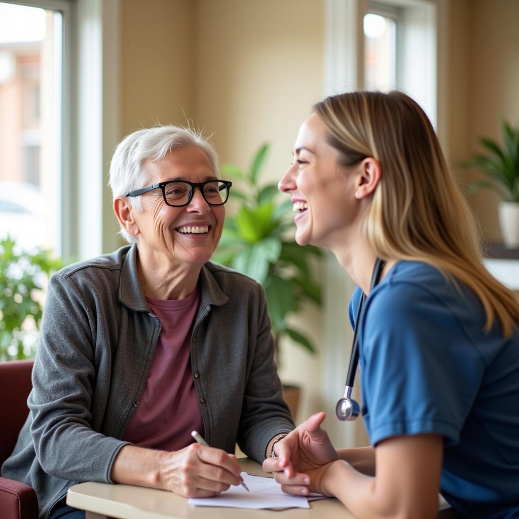 Happy resident with caregiver in long-term care