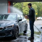 Rinsing a car at a self-service car wash