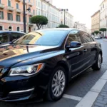 Modern sedan parked at Rome Fiumicino Airport curbside pickup