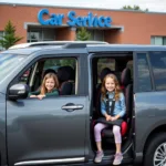 Children safely secured in a car during school pick up