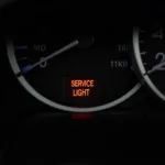 Service light illuminated on a car dashboard