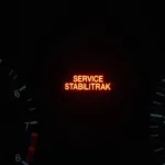 Service Stabilitrak Warning Light on Car Dashboard