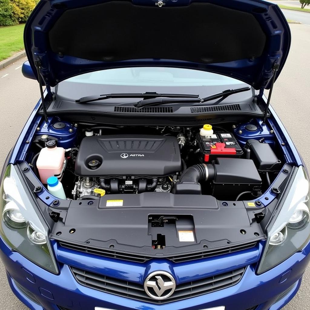 Open hood of a Vauxhall Astra H revealing the engine bay