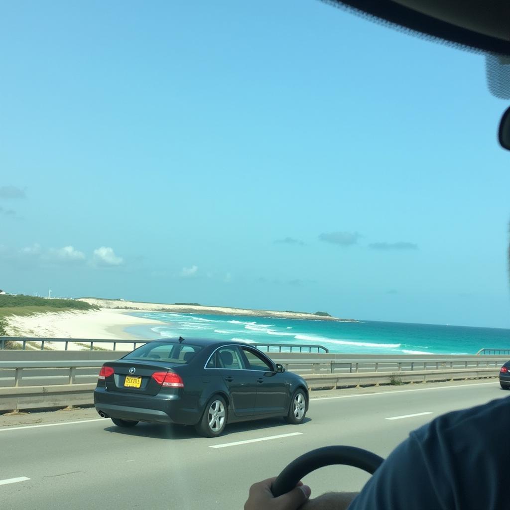 Enjoying the Scenic 30a Coastal Drive: A car driving along Highway 30a, showcasing the beautiful coastal scenery and highlighting the relaxing experience of using a car service to enjoy the views.