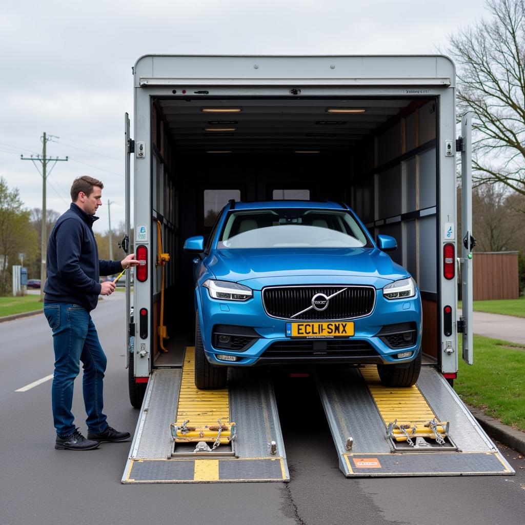 Car Being Loaded onto Transport Trailer