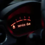 Car Dashboard with "Service Due" Light Illuminated