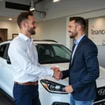 Car Salesman Shaking Hands with Customer After Closing Deal