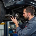 Mechanic inspecting a car during a full service