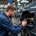 Mechanic Inspecting an LPG System in a Car Service Center