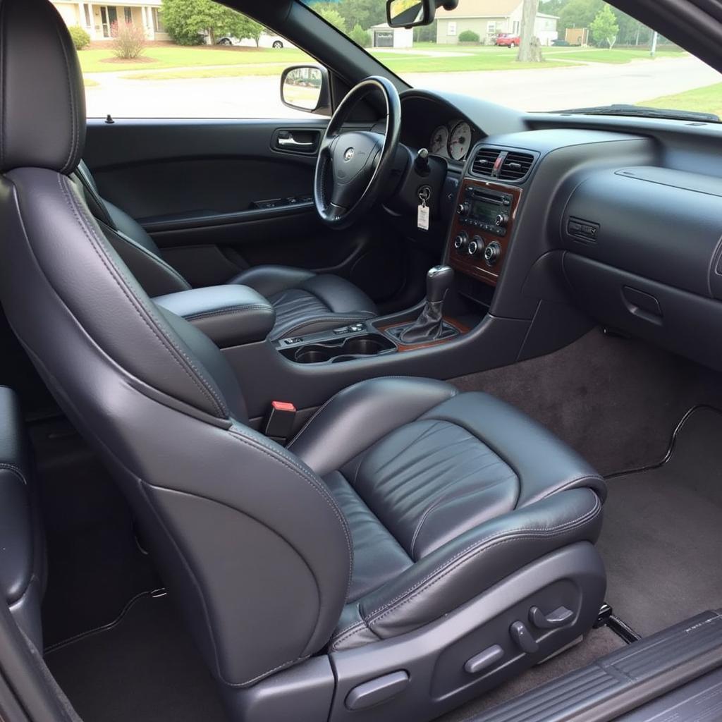 Interior car detailing in Chennai showing spotless leather seats.