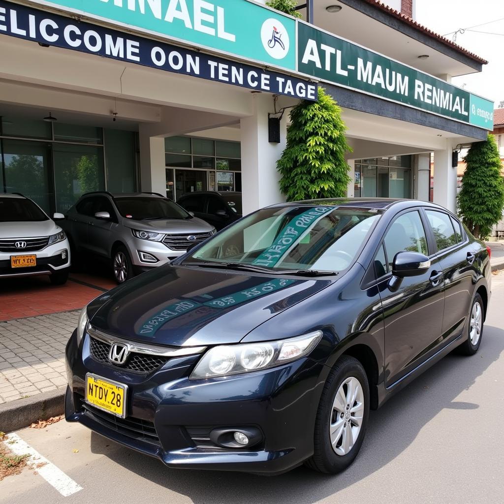 A well-maintained rental car parked in front of a reputable agency in Phnom Penh