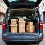 Spacious boot of an Ambassador car filled with packages