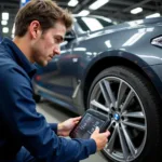 BMW Technician Using Diagnostic Tools