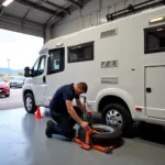 Technician Changing a Camping Car Tire in Yverdon