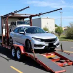 Car Being Loaded onto a Car Carrier