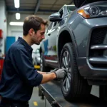 Mechanic working on a car in a Brooklyn auto repair shop