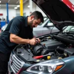 Mechanic Working on a Car Engine