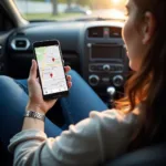 Person using a smartphone to search for a car service center near their location.