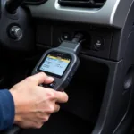 Car diagnostic tool in use at a Plymouth repair shop