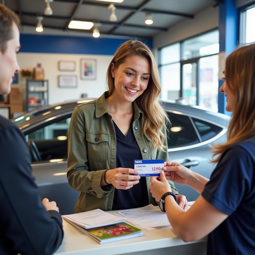 Woman Paying for Car Service with NHS Discount