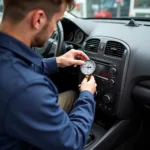 Car AC Service in Brentwood: A technician inspecting a car's air conditioning system.