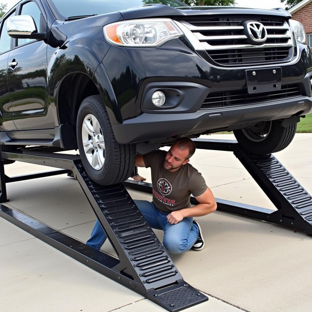 Car on Black Widow PSR295 Ramps for Oil Change